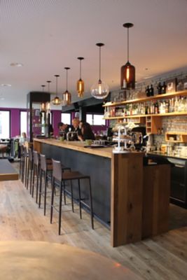 modern pendant lighting above bar in restaurant