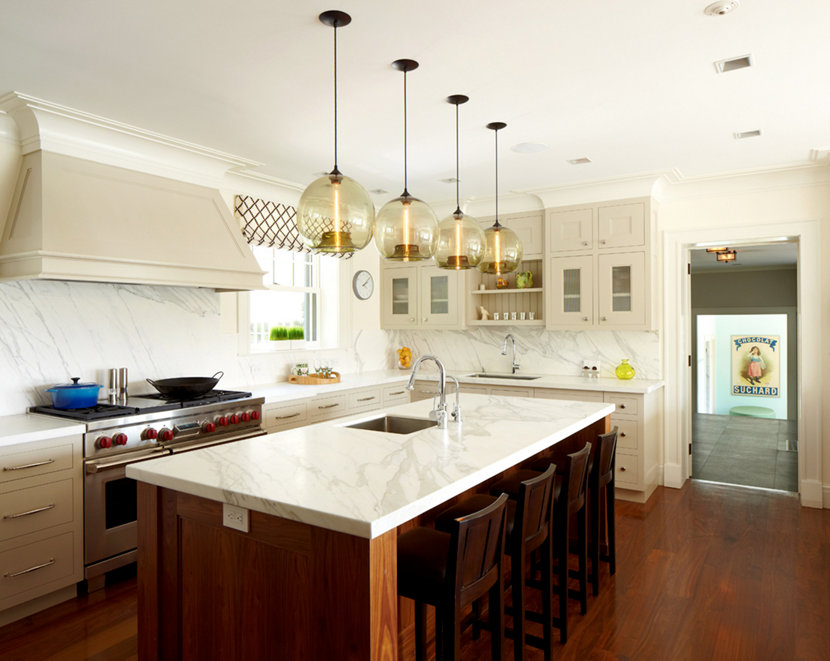 Four Stamen Modern Pendant Lights Hang Above The Kitchen Island