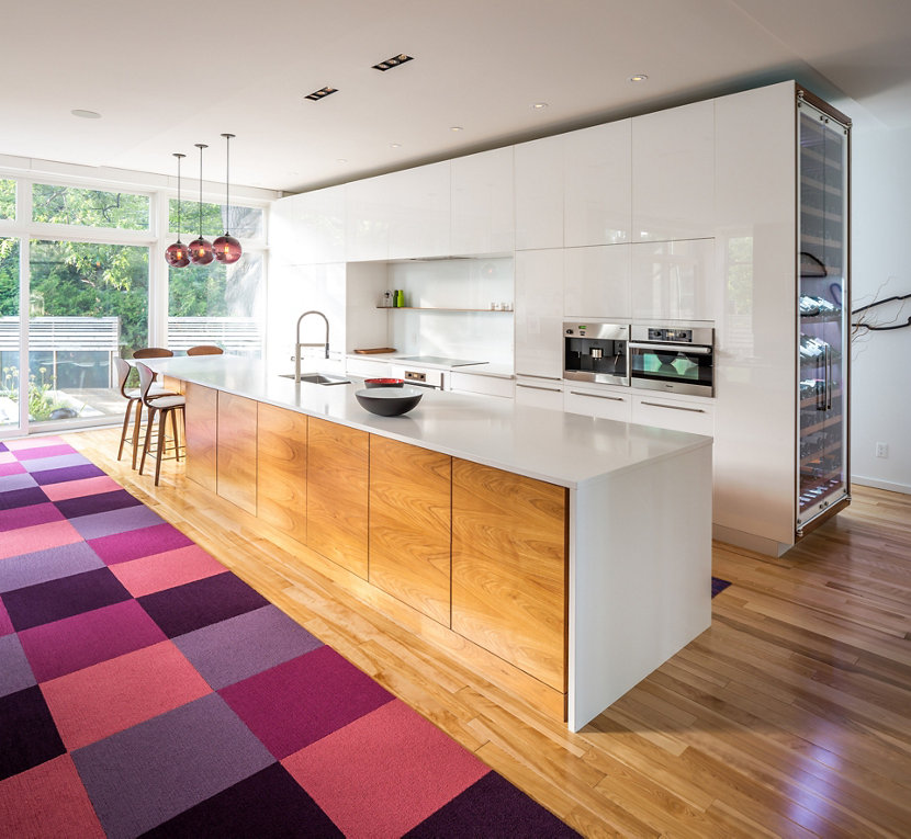 A Trio of Our Solitaire Pendants in Plum Glass Hang Above This Eat-in Kitchen Island