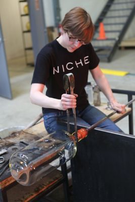 Andrea finishing a Bella pendant light