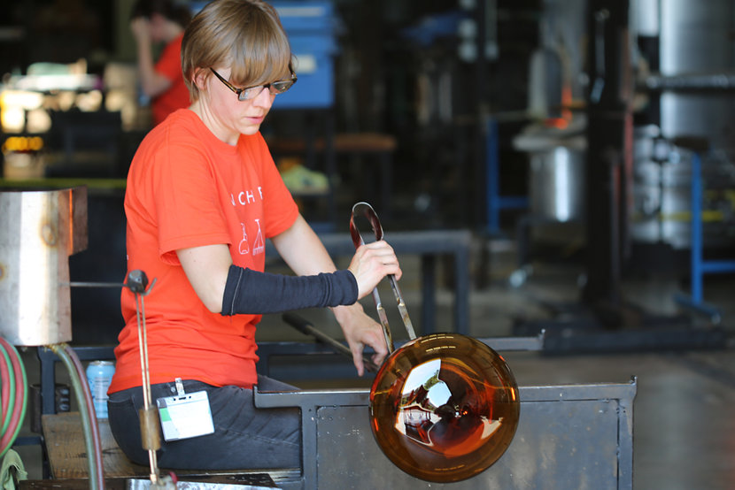 Andrea doing glassblowing demonstrations at our Factory Sale