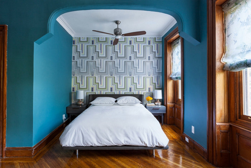 master bedroom with teal painted accent wall