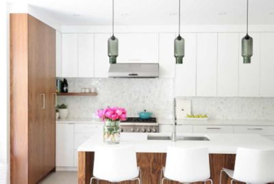 Gray glass pendant lighting above kitchen island