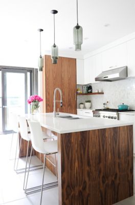 Gray glass pendant lighting above kitchen island