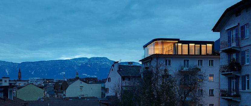 Outside View of Apartment with Modern Dining Room Lighting