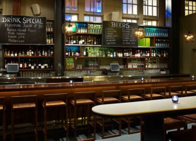 large glass pendant lights above bar