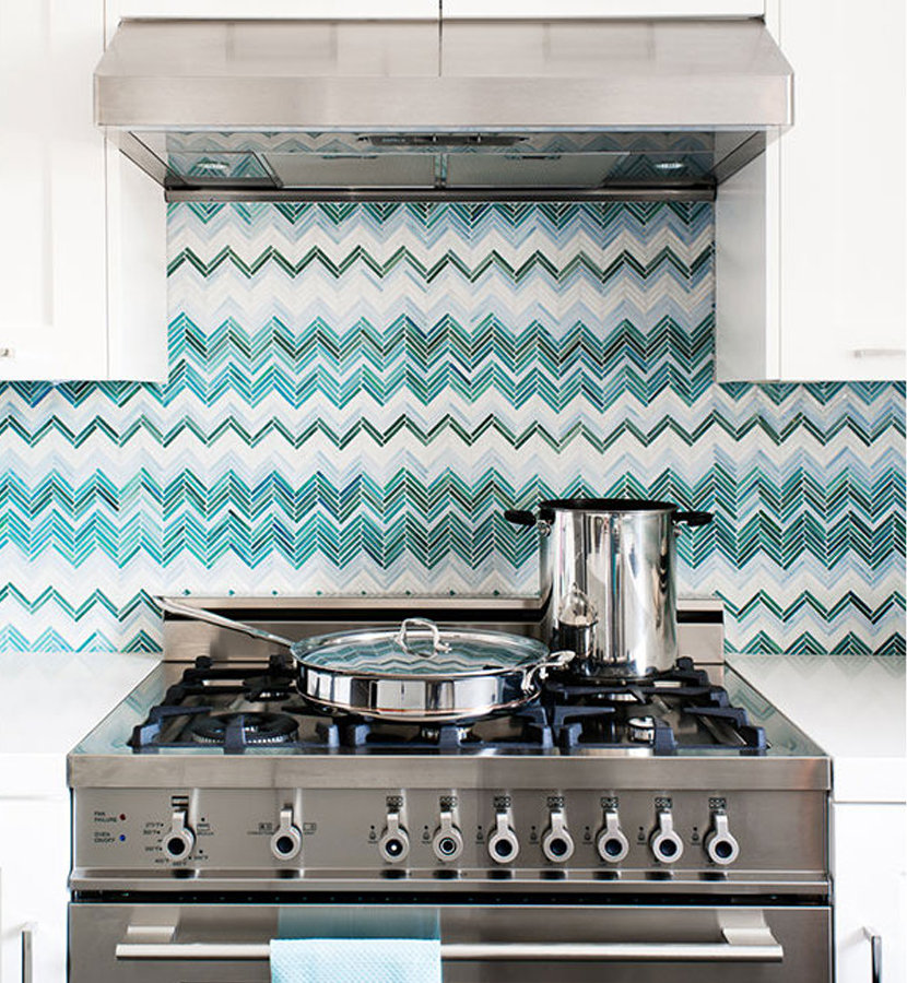 Teal zig zag kitchen backsplash behind stove.