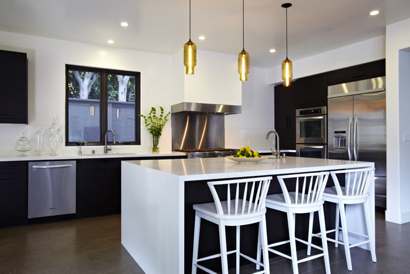 Amber pendant lighting shines bright in modern kitchen