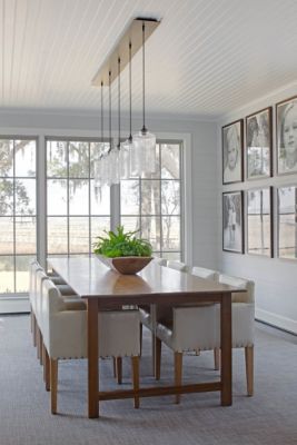 A Ceiling Canopy Creates a Sleek Finish for this Dining Room Pendant