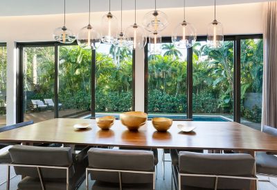 glass pendant lights over dining table