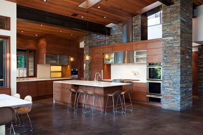 A Trio of Aurora Pendants Hangs over the Kitchen Island