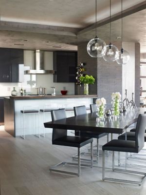 Clear Glass Modern Pendants Over a Dark Wood Dining Table