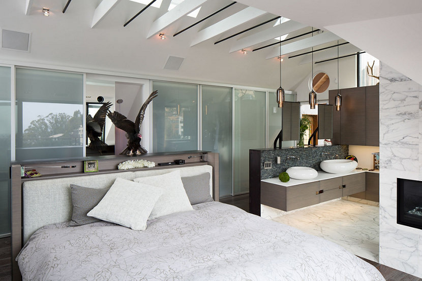 A Trio of Pharos Pendants in Gray Glass Hangs above the Vanity