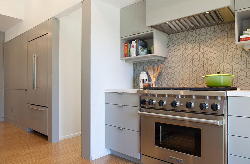 Smoke Glass Complements Gray Cabinetry and Geometric Backsplash