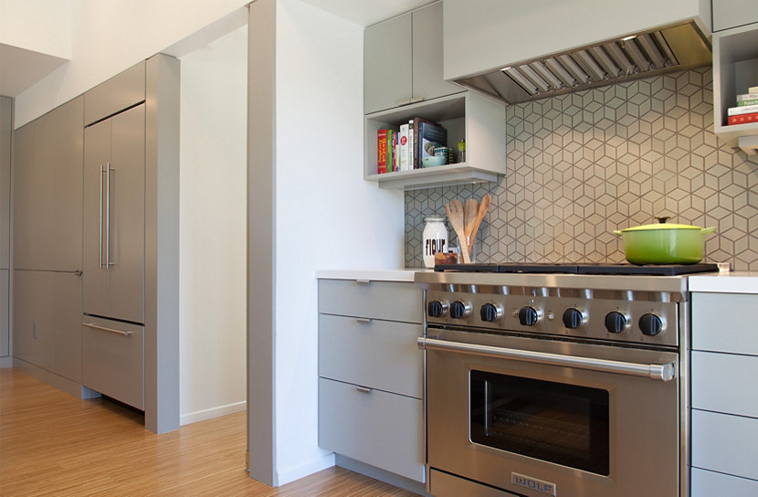 Smoke Glass Complements Gray Cabinetry and Geometric Backsplash Smoke Glass Complements Gray Cabinetry and Geometric Backsplash
