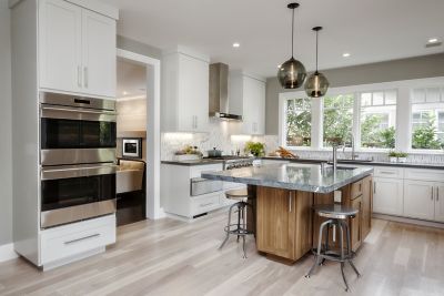 Two Stamen Pendants in Gray Glass Hang Over a Kitchen Island